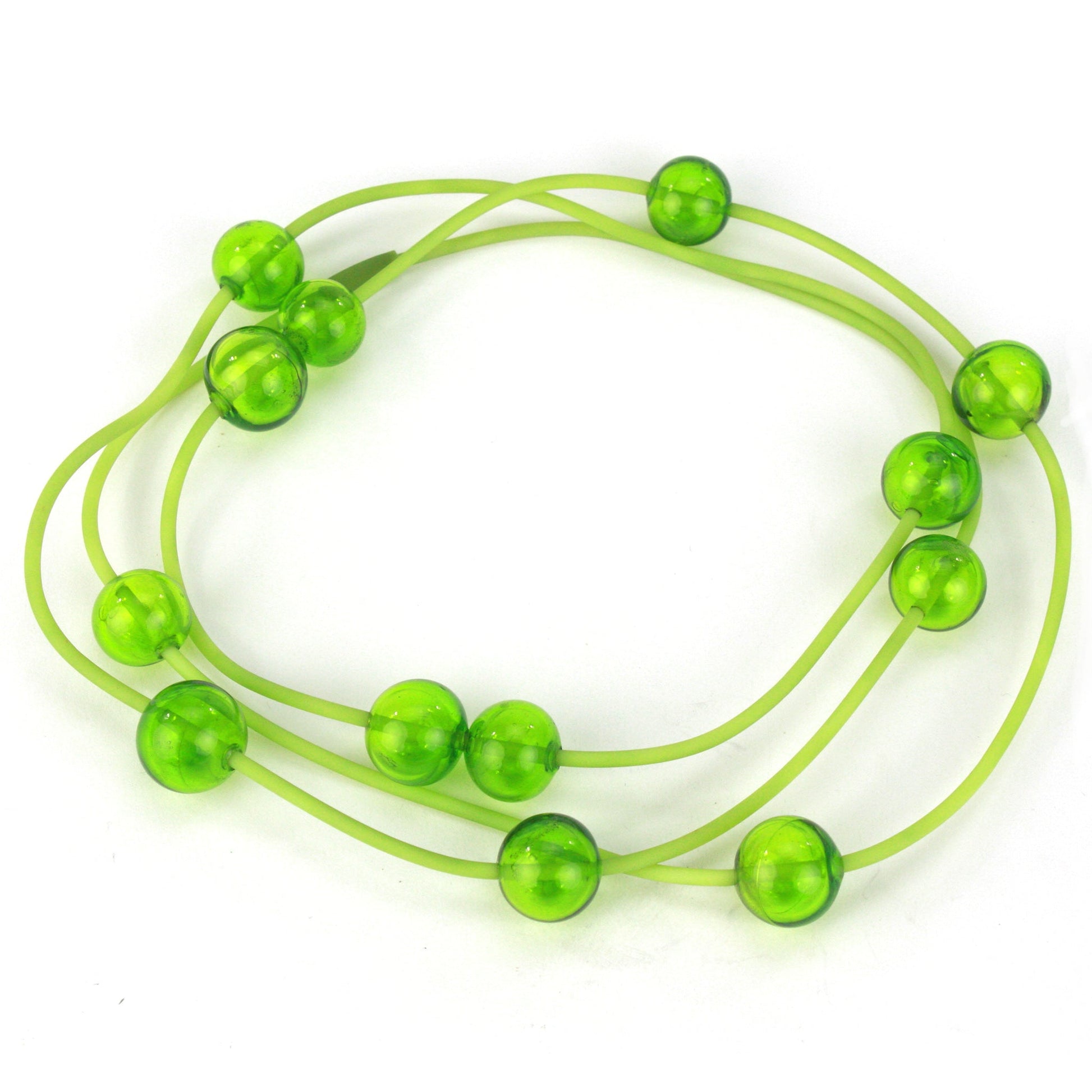 Orbit Necklace in Lime with handblown glass beads on a hand-dyed silicone cord. Features adjustable beads for customizable styling options.