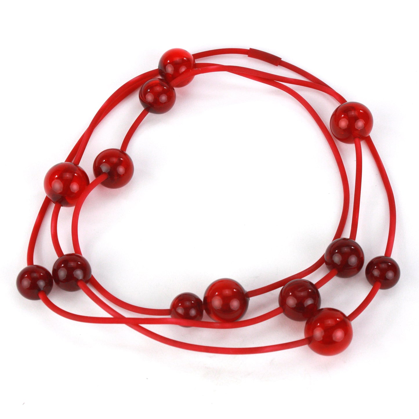 Orbit Necklace in vibrant red with handblown glass beads strung on a hand-dyed silicone cord. Versatile design for long or layered wear.