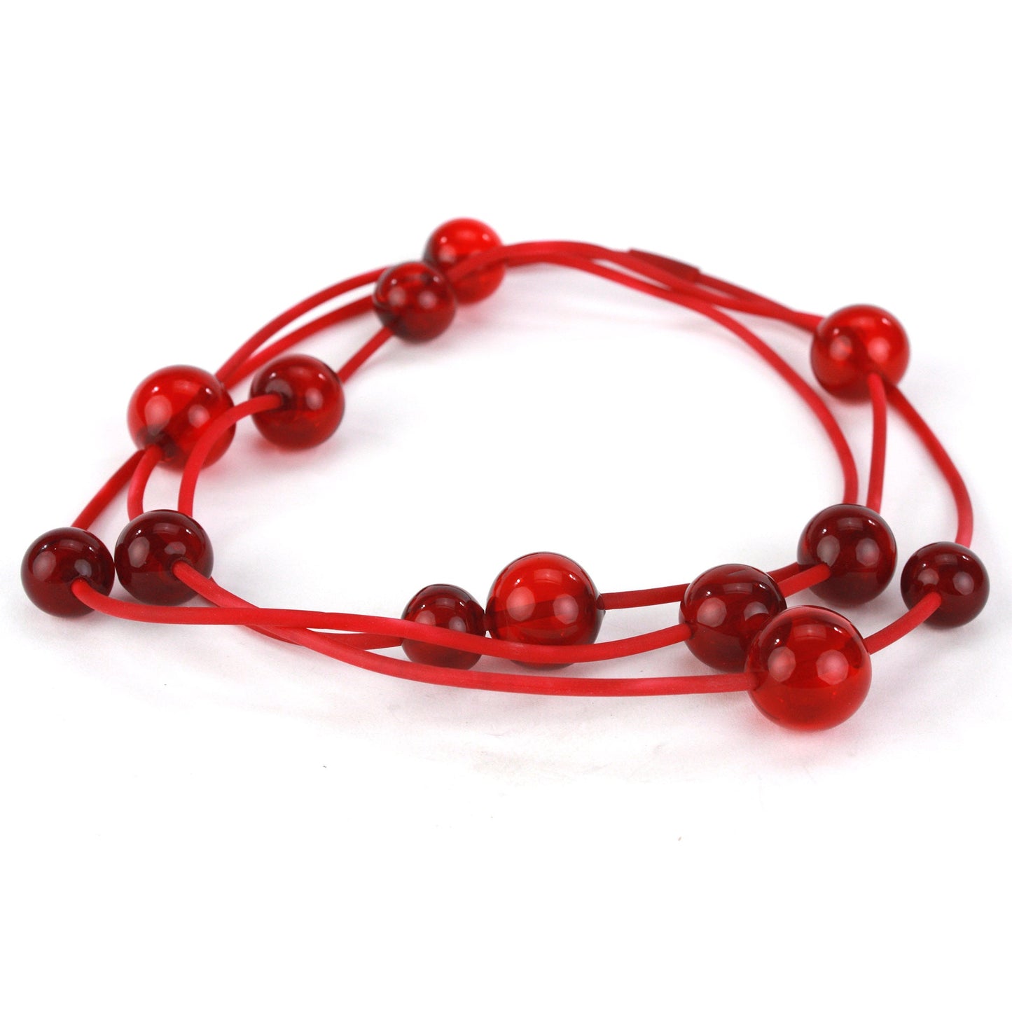 Orbit Necklace in vibrant red with handblown glass beads strung on a hand-dyed silicone cord. Versatile design for long or layered wear.