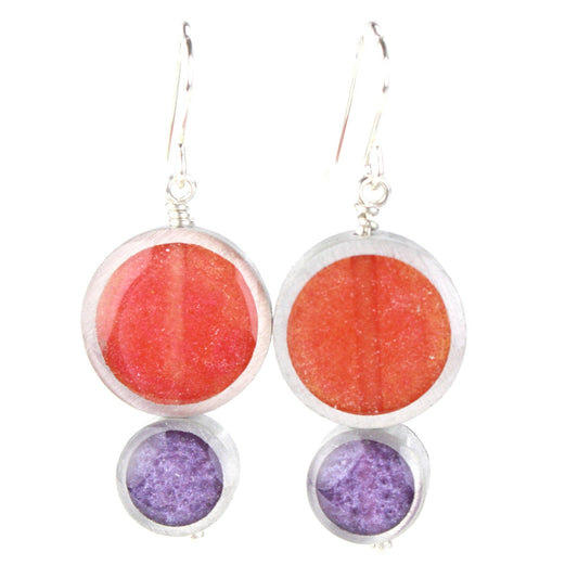 Bright red and lavender Resinique Double Circle Earrings made with eco-resin and salvaged aluminum, featuring sterling silver ear wires for a bold, sustainable look.