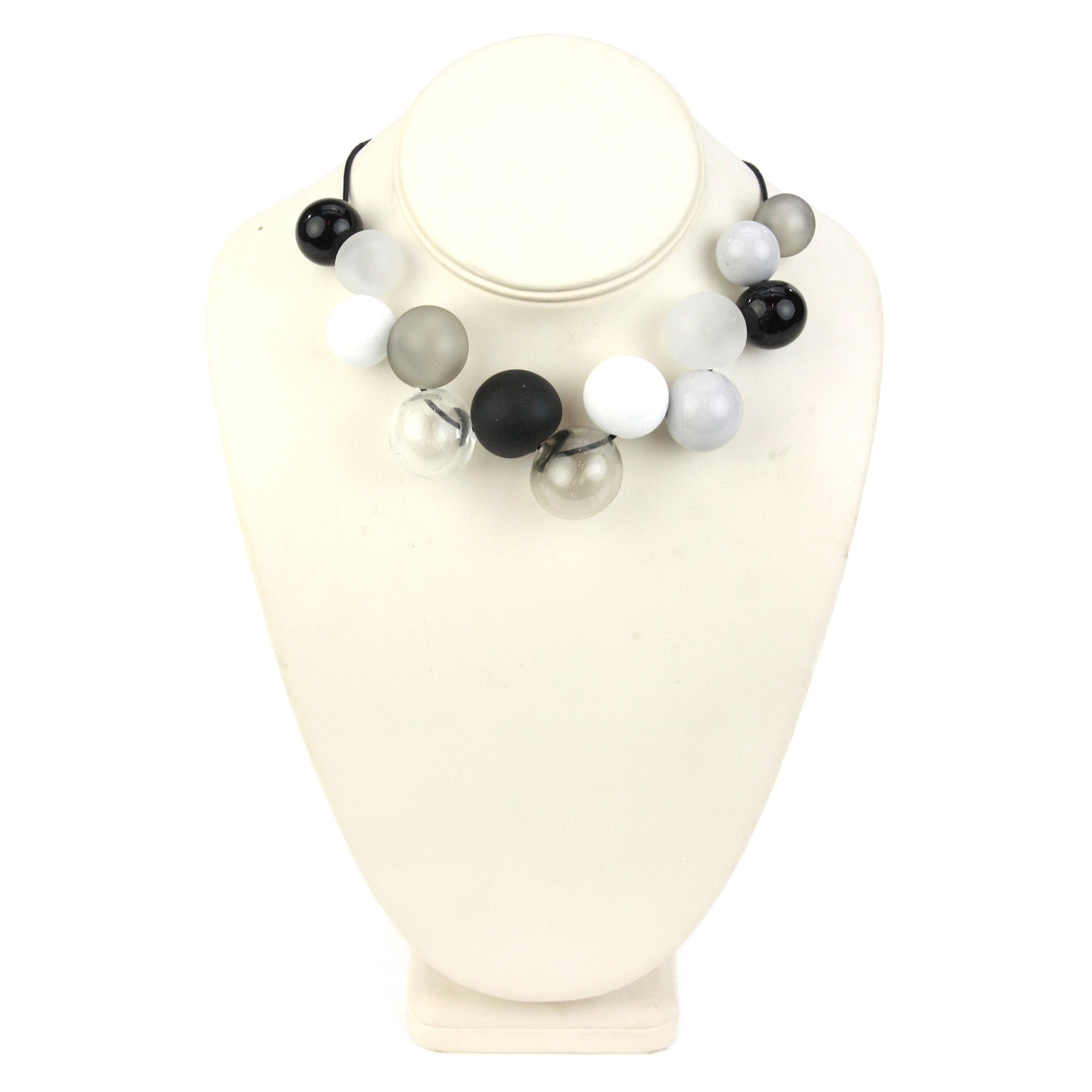 Elegant Offset Bolla Necklace with black, white, and gray hand-blown glass beads. Adjustable from 36" to choker length on fine leather. Perfect for any outfit!