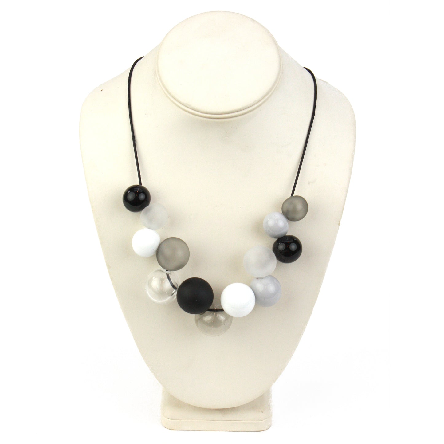 Elegant Offset Bolla Necklace with black, white, and gray hand-blown glass beads. Adjustable from 36" to choker length on fine leather. Perfect for any outfit!