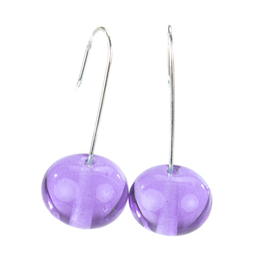 Color-changing glass bead earrings on sterling silver hooks. Handmade beads shift from purple to blue under fluorescent light, approximately 1.25 inches long.