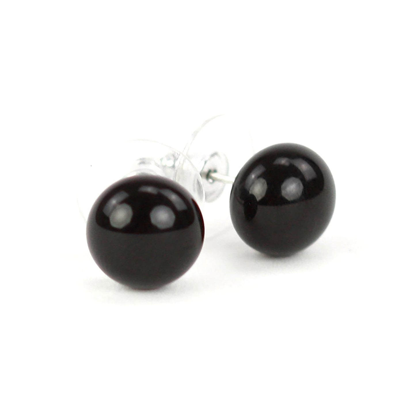 Pair of small shiny black glass stud earrings with sterling silver posts and clear earring backs.