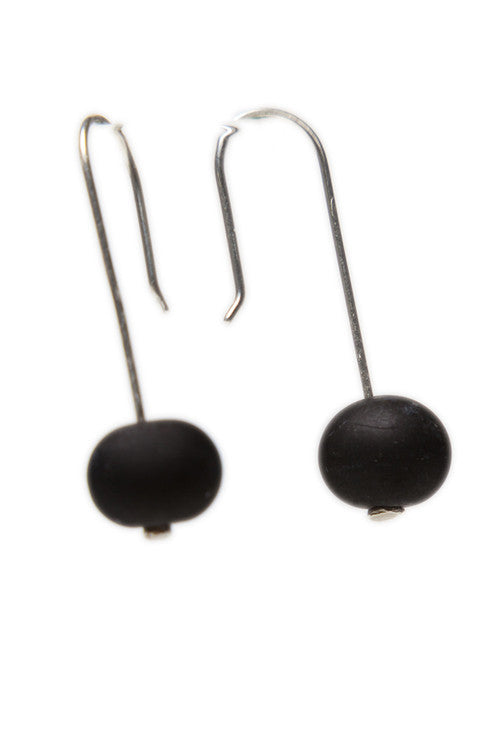 Discover matte black glass bead earrings handcrafted with sterling silver hooks. Sleek, lightweight, and perfect for modern, everyday elegance.