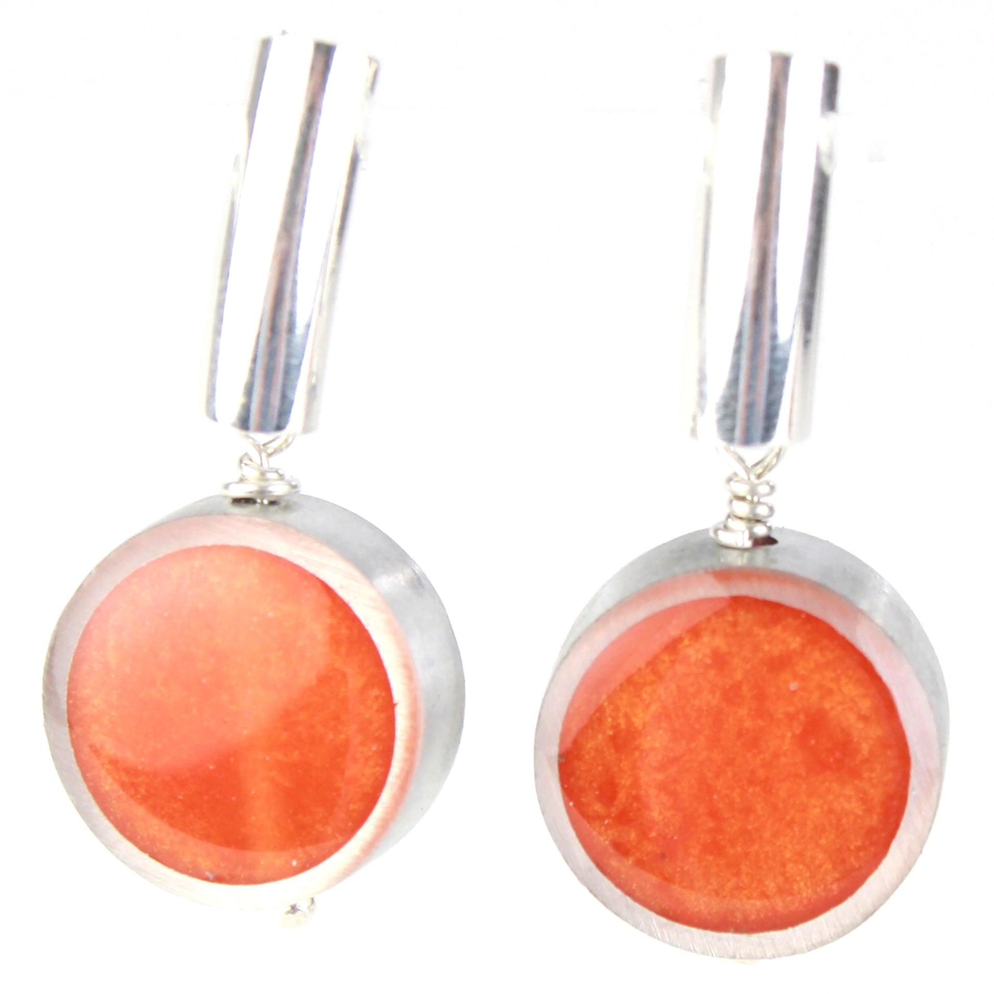 Pair of orange eco-resin and salvaged aluminum drop earrings with a matte finish, suspended from sterling silver ear wires.

