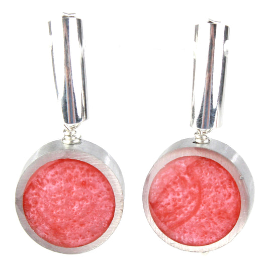 Light pink eco-resin and salvaged aluminum drop earrings with matte finish, hanging from sterling silver ear wires.