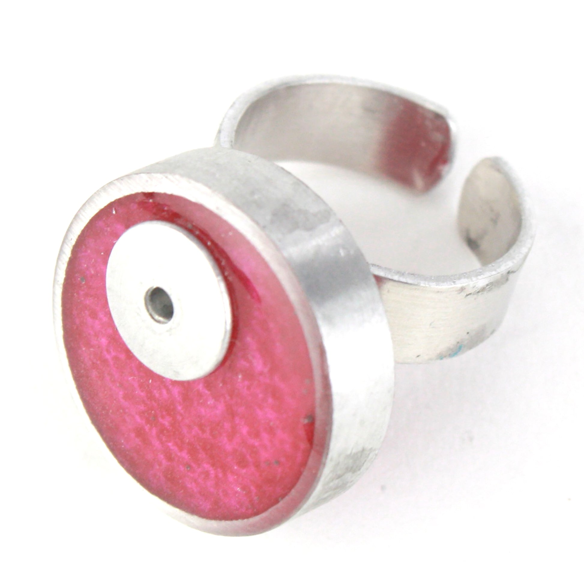 Bright pink Resinique Single Circle Ring featuring a vivid eco-resin centerpiece set in salvaged aluminum with an adjustable band for a perfect fit.