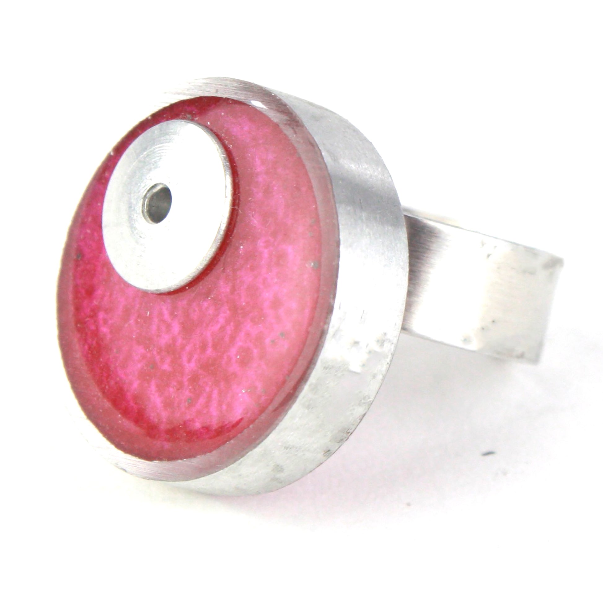 Bright pink Resinique Single Circle Ring featuring a vivid eco-resin centerpiece set in salvaged aluminum with an adjustable band for a perfect fit.