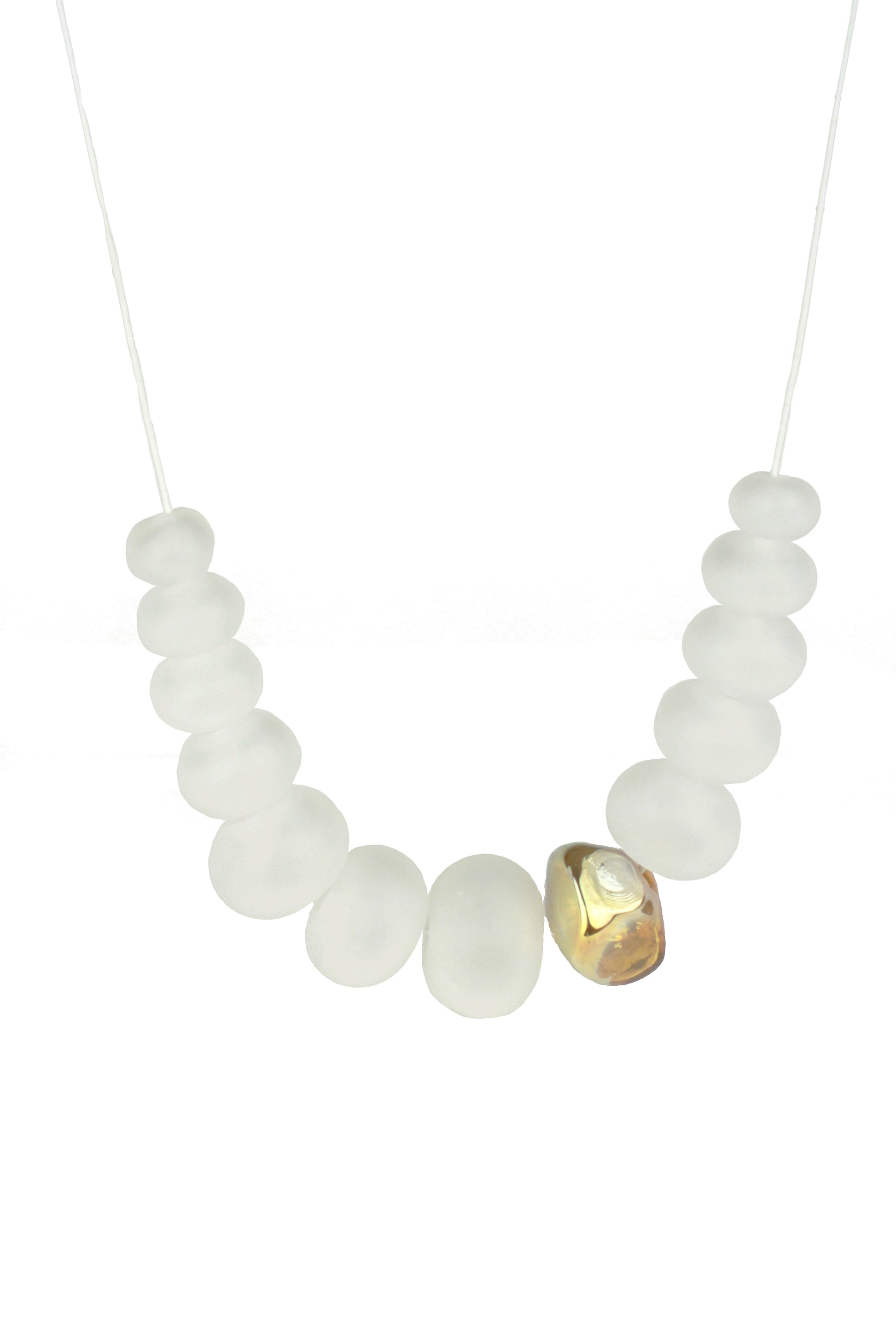Necklace of hand blown and sandblasted hollow beads in soft white glass paired with a gold glass nugget bead and strung on adjustable leather