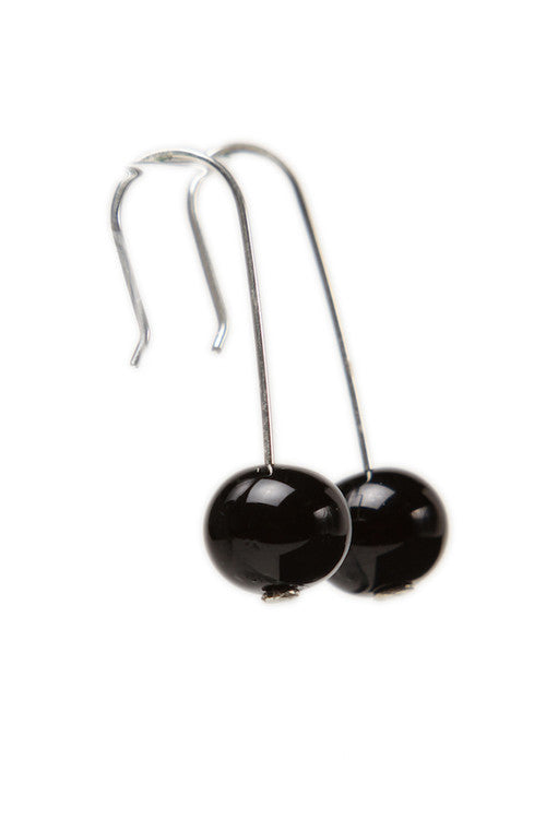 Handmade shiny black glass beads hung on sterling silver long ear wires.