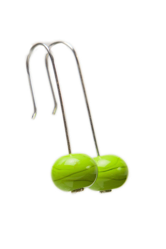 Handmade lime green glass beads hung on sterling silver long ear wires.