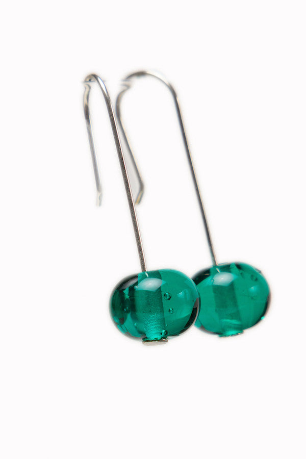 Handmade teal glass beads hung on sterling silver long ear wires.